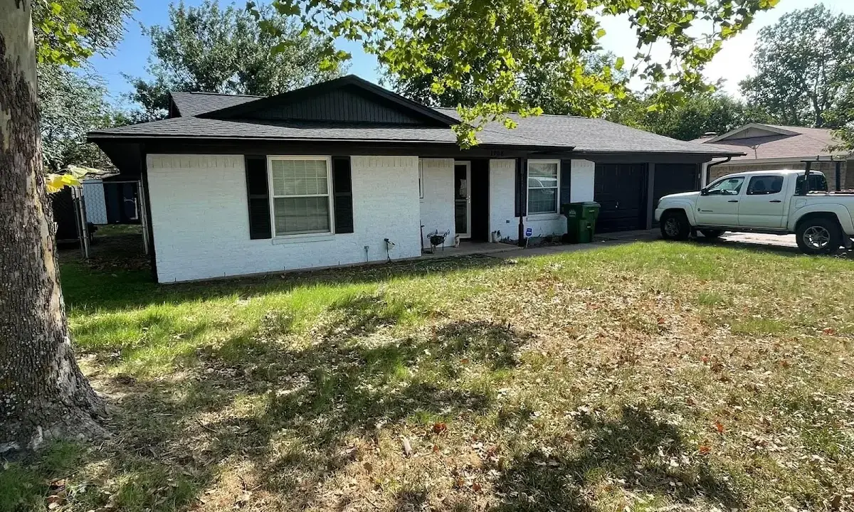 Professional roofing crew working on a residential roof in Dolton
